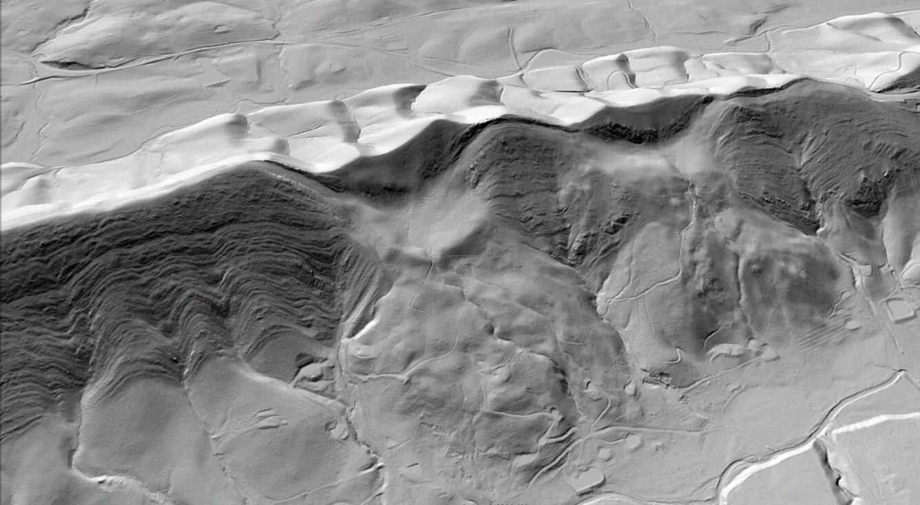 Areal hillshade image of a hillside with lobe-shaped landslide deposits