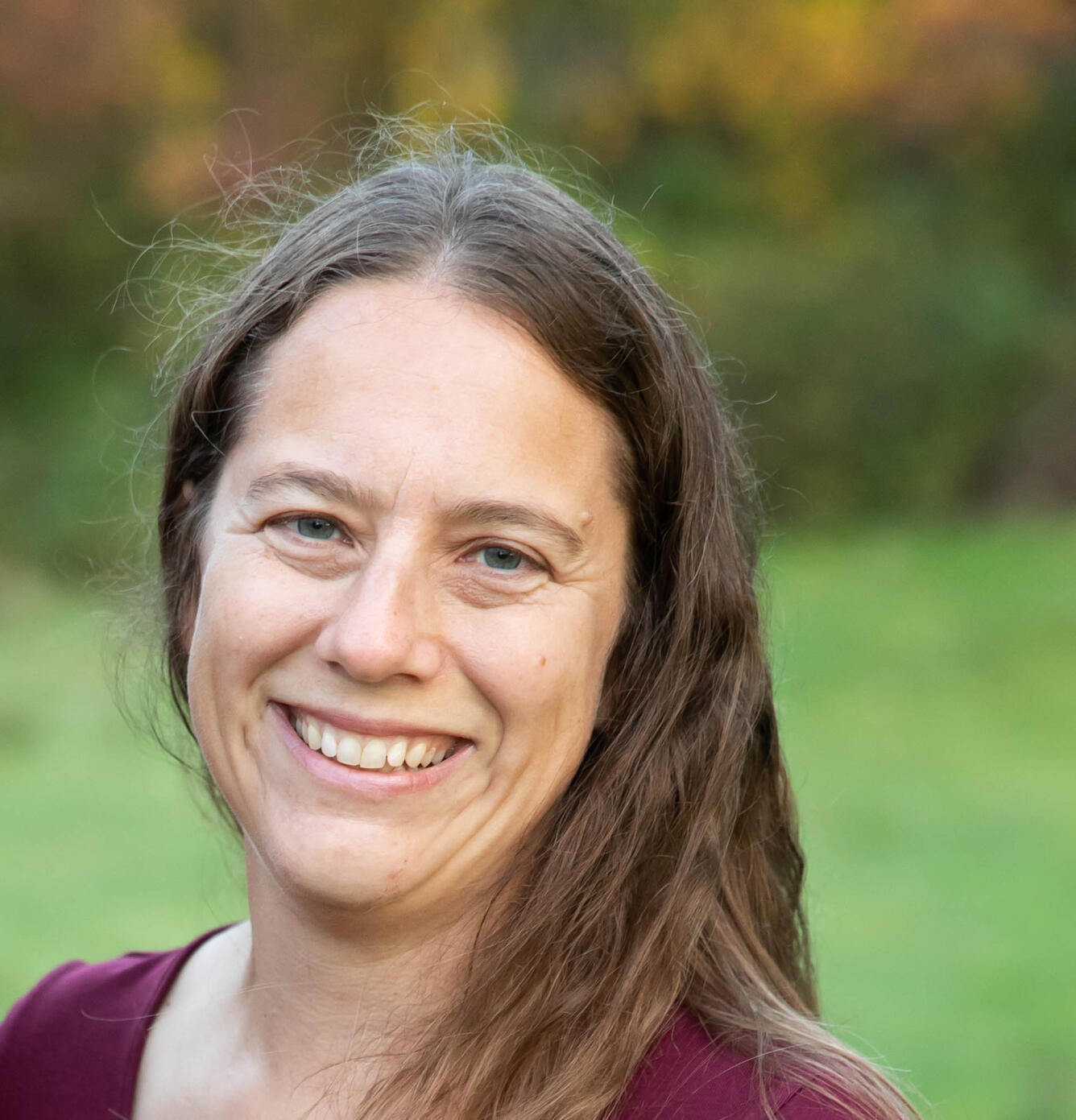 scientist with long brown hair and blue eyes