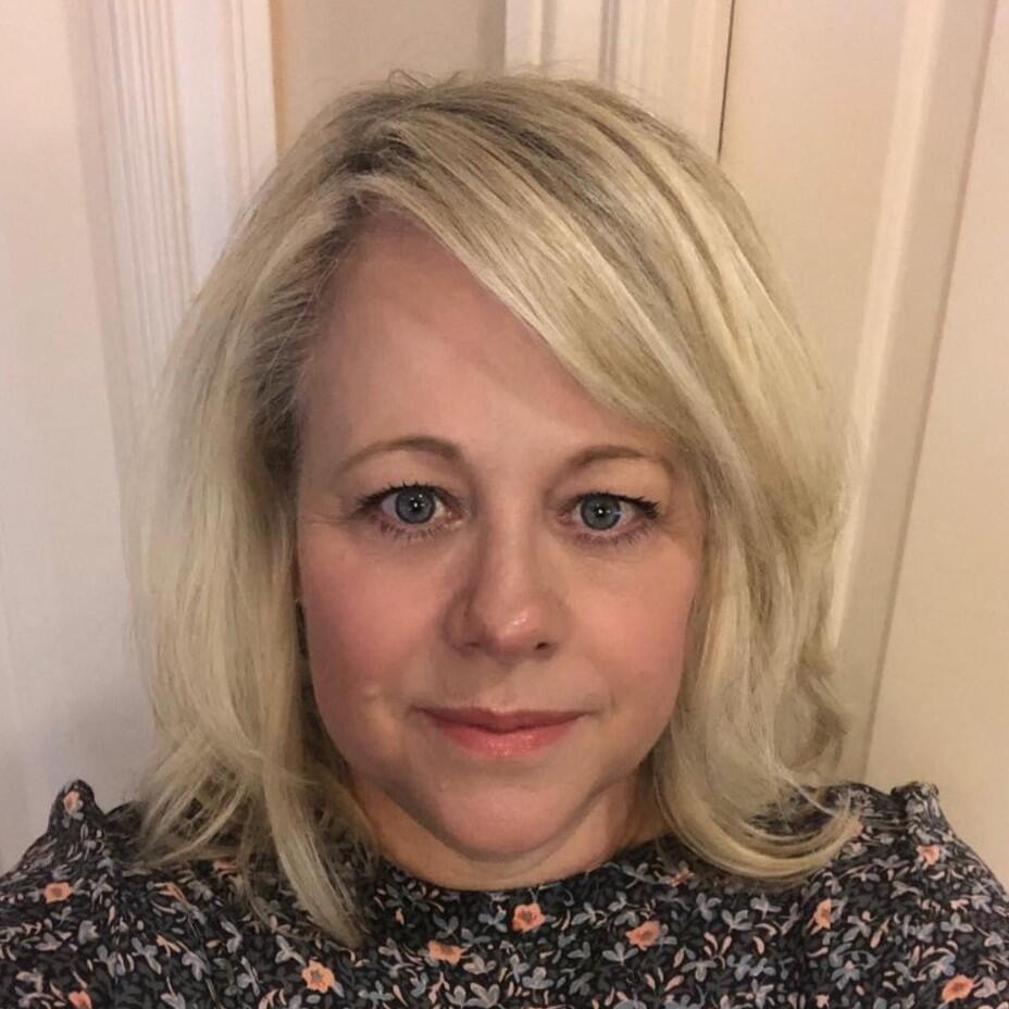 Blond woman looking at camera