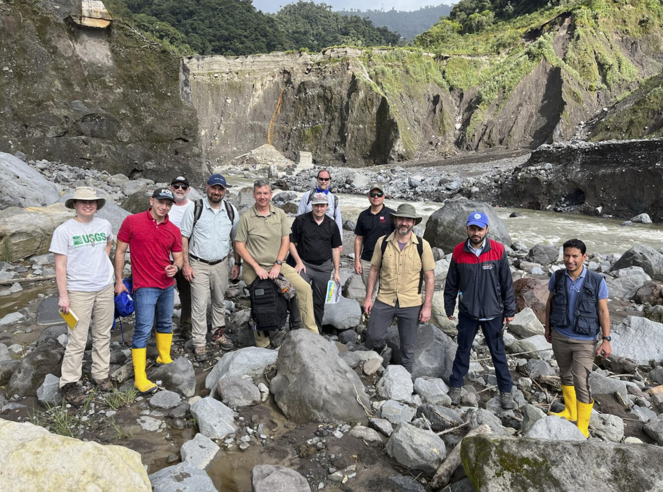 Photo shows International, interagency team during a field site visit to the Rio Coca, February 7, 2023