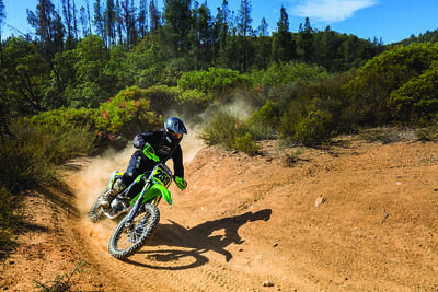 Male on a motorcycle on dirt road