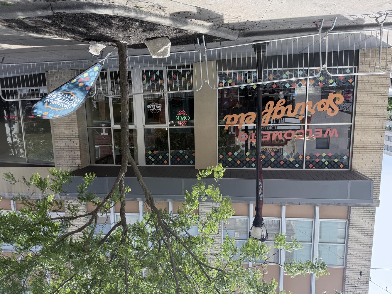 Exterior of a visitor center with “Springfield Route 66 Welcome Center” on a window