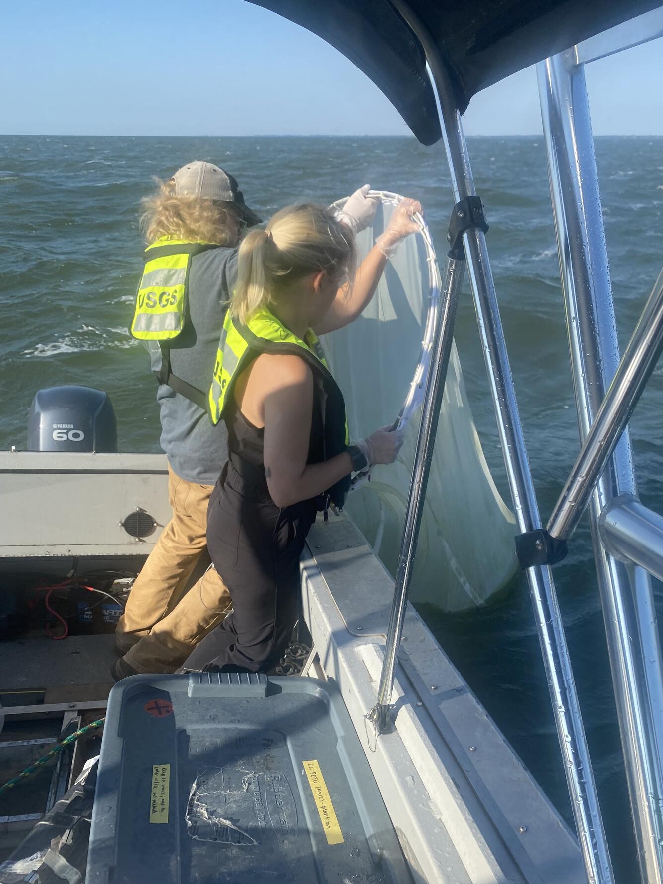 USGS scientists collecting phytoplankton for mercury and PFAS analyses in Saginaw Bay of Lake Huron