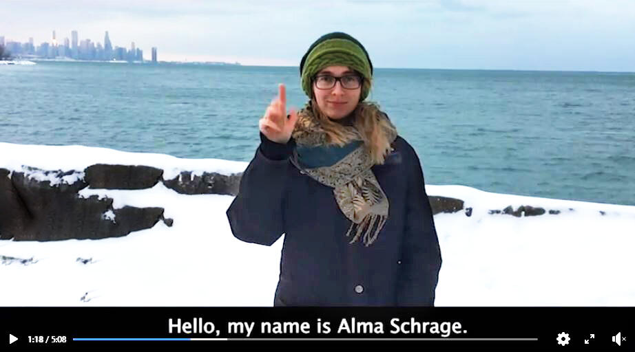 Alma Schrage Using American Sign Language in a screen capture from a video