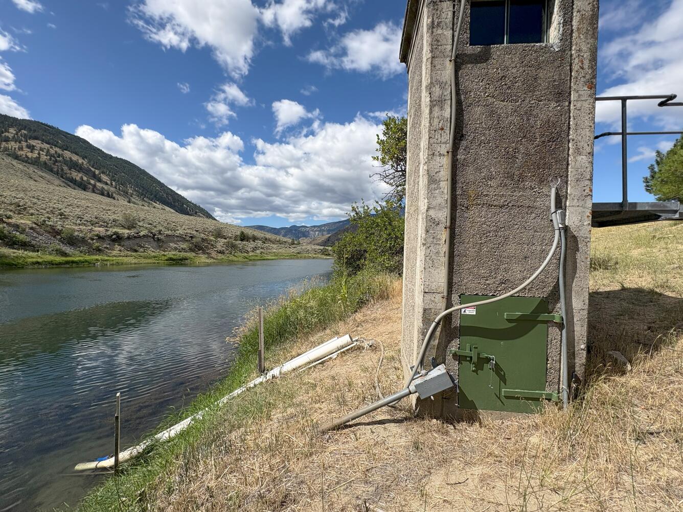Concrete shed next to river
