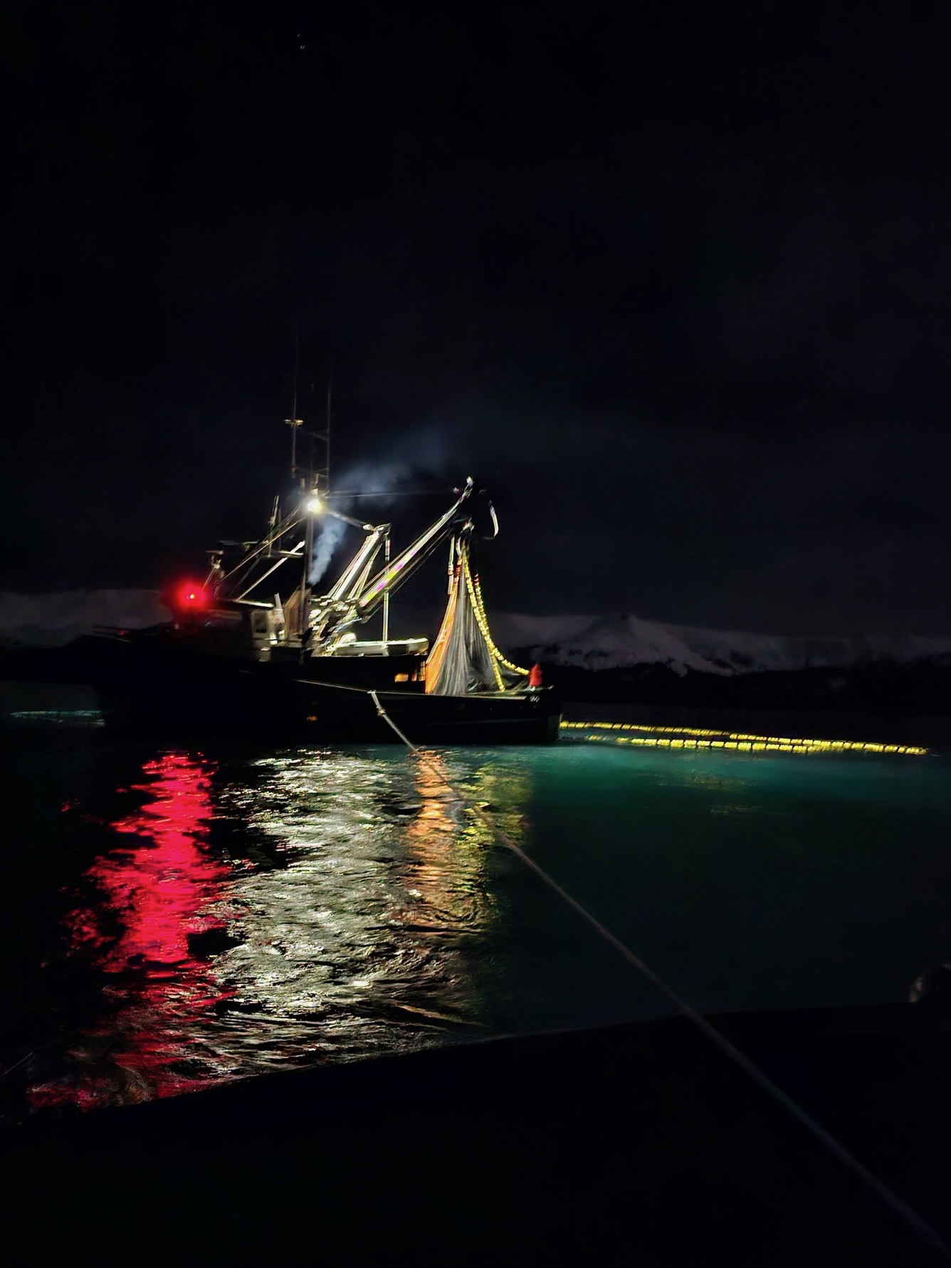 Research Vessel Solstice at night with seine net deployed