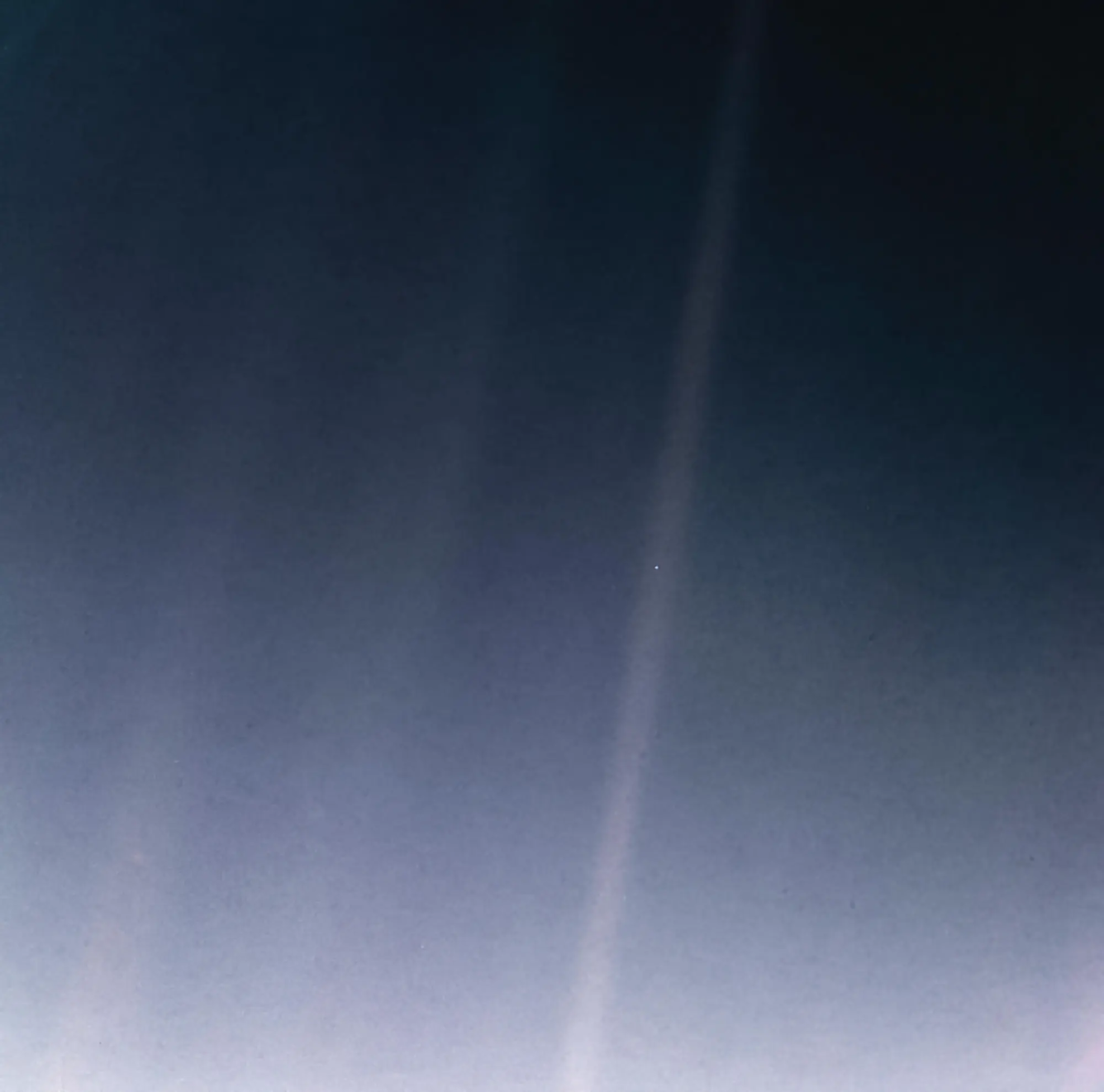 This is a picture of Earth in space described as a Pale Blue Dot. 