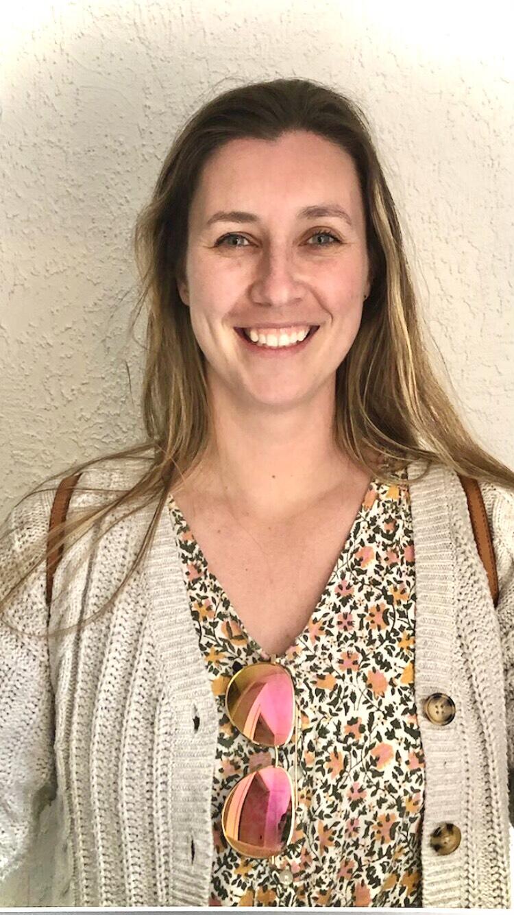 headshot of Kayla tinker on a cream background