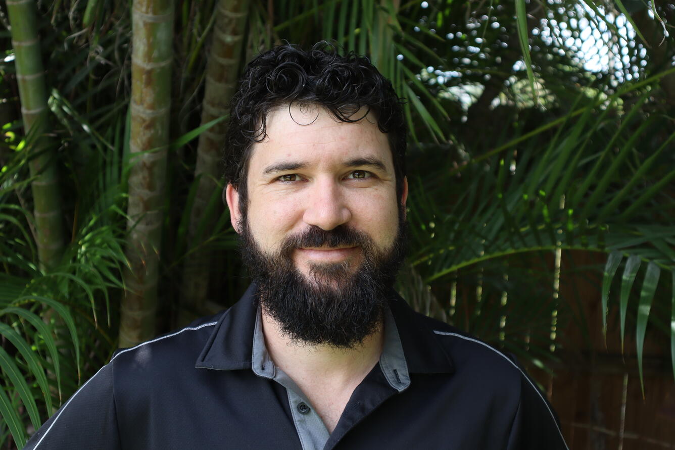 A staff profile photo of Travis Knight