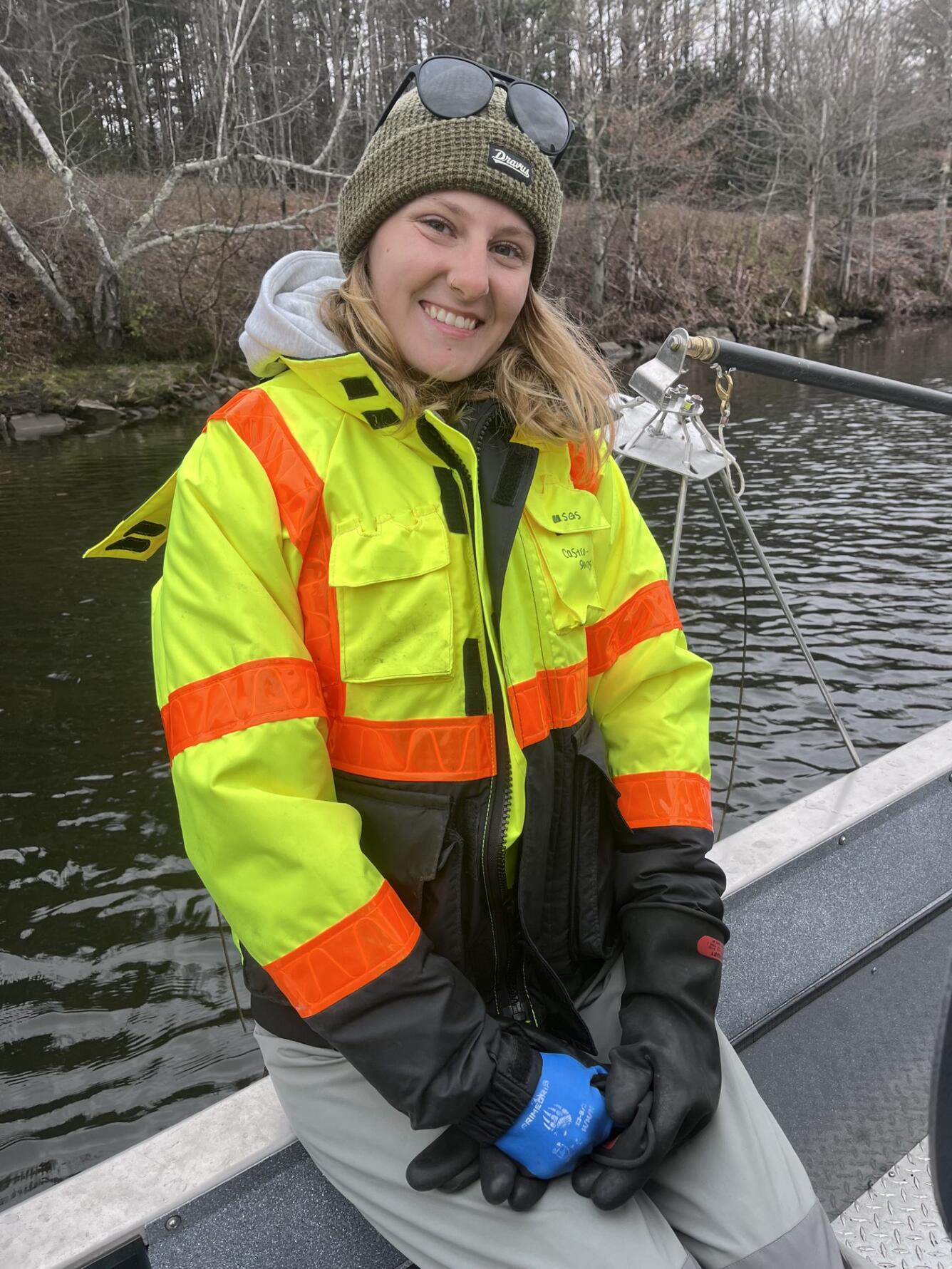 Young woman in boat wearing a PFD