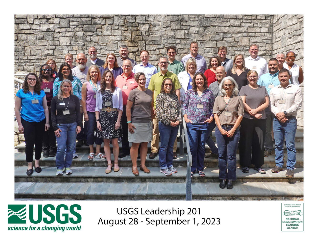 Leadership Development Course 201 group photo in front of stone wall