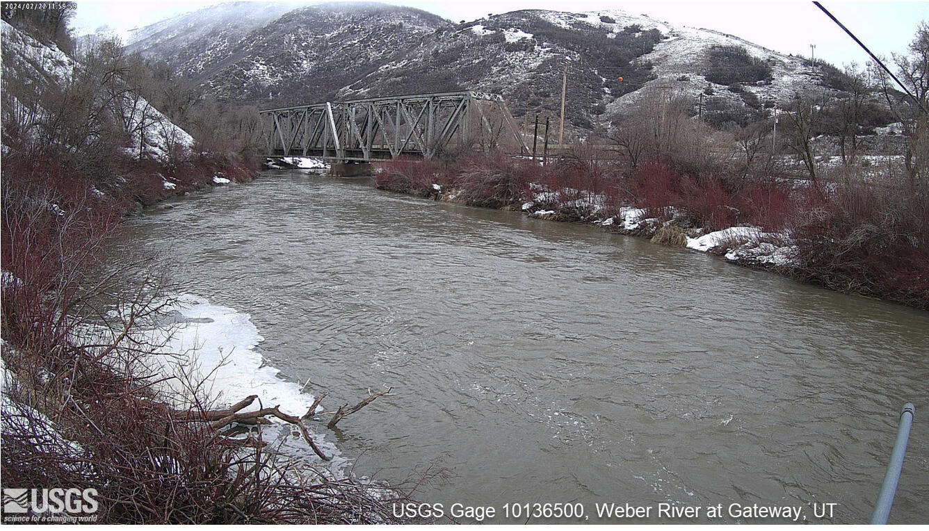View of Weber River with snow on banks.