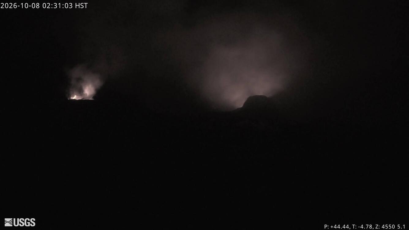 Color photograph of volcanic vents glowing at night