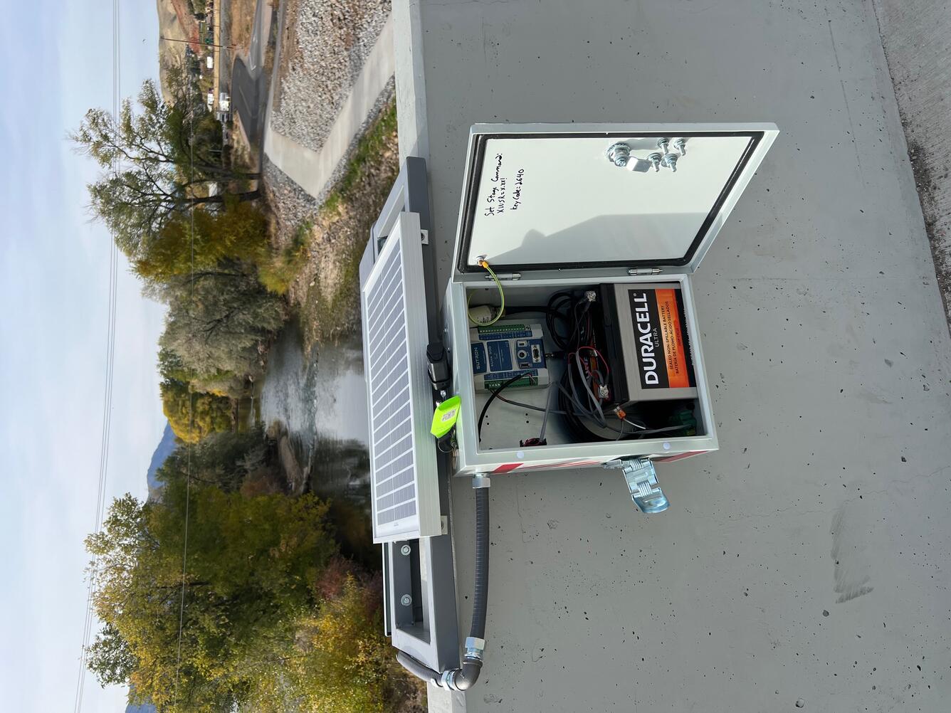 Opened box on bridge wall showing inside.