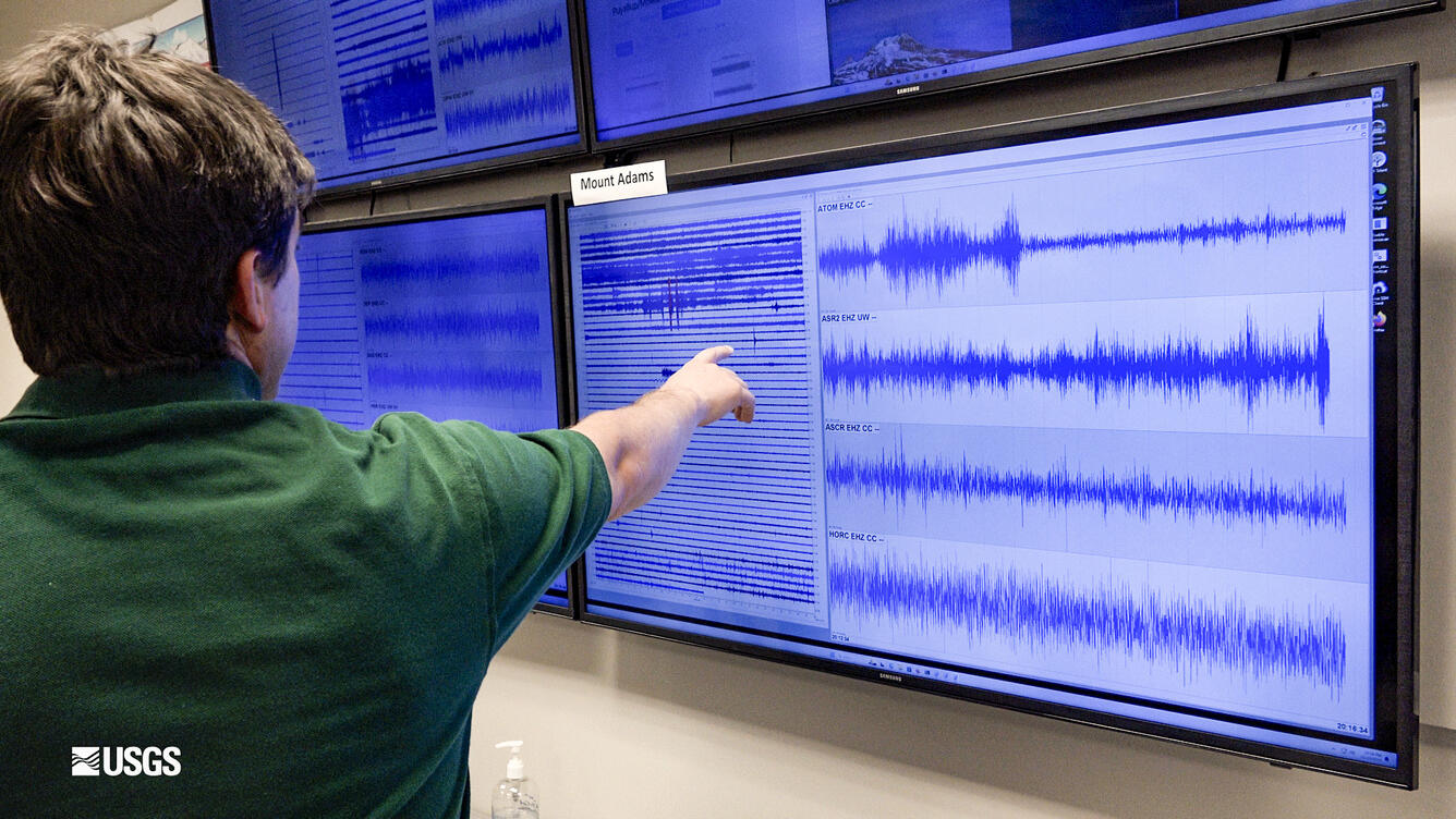 CVO Seismologist Wes Thelen pointing out a small earthquake at Mount Adams.