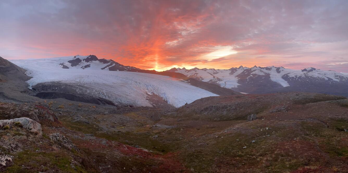 Orange sunrise over a glacier