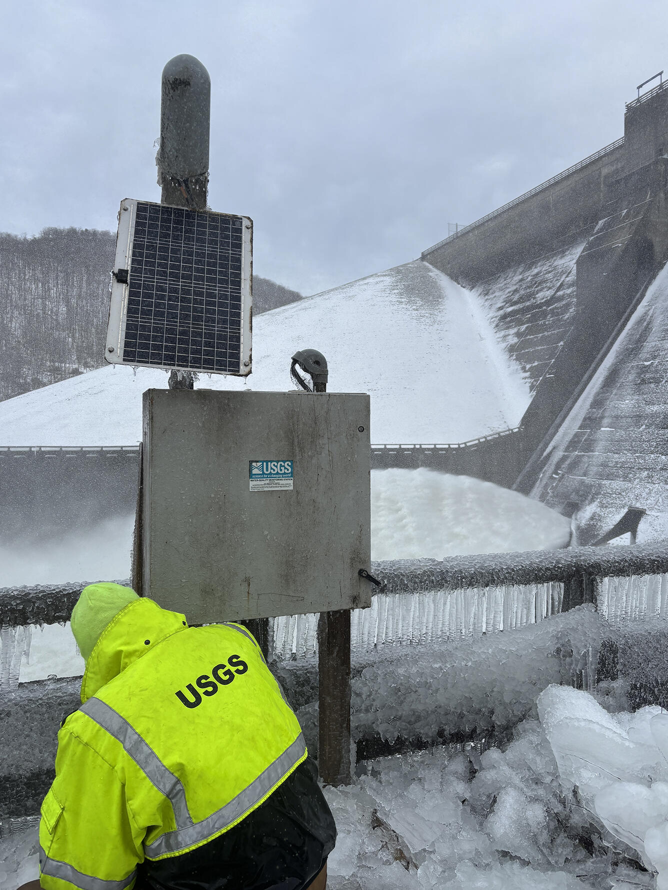 Technician removes a water quality deployment for the winter.