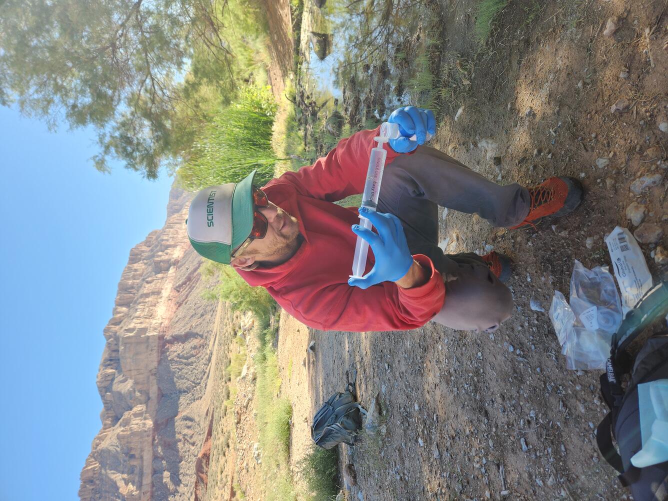 Zach Harrison collects a water quality sample at Willow Spring, AZ