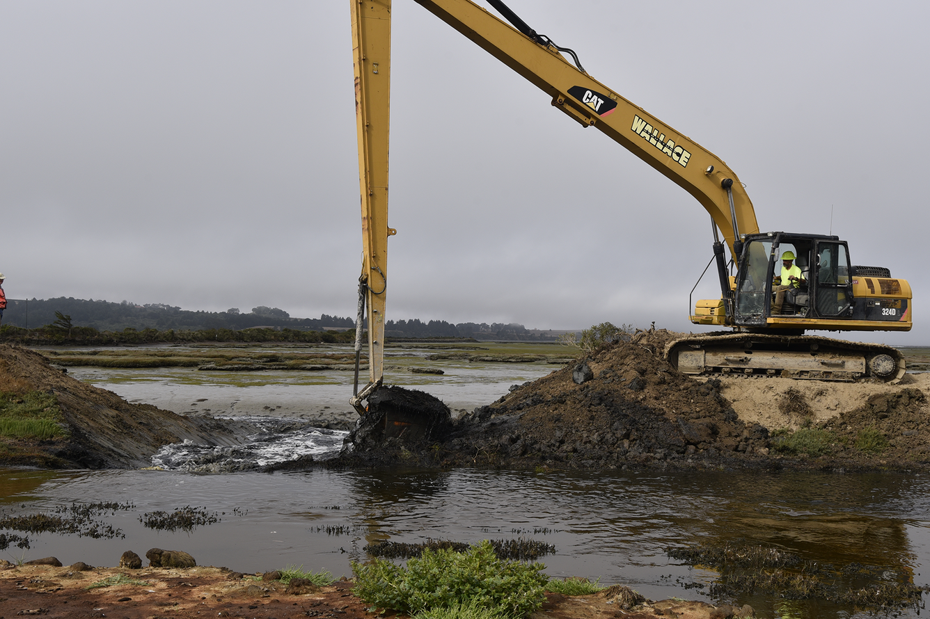 Backhoe breaching Humboldt dike