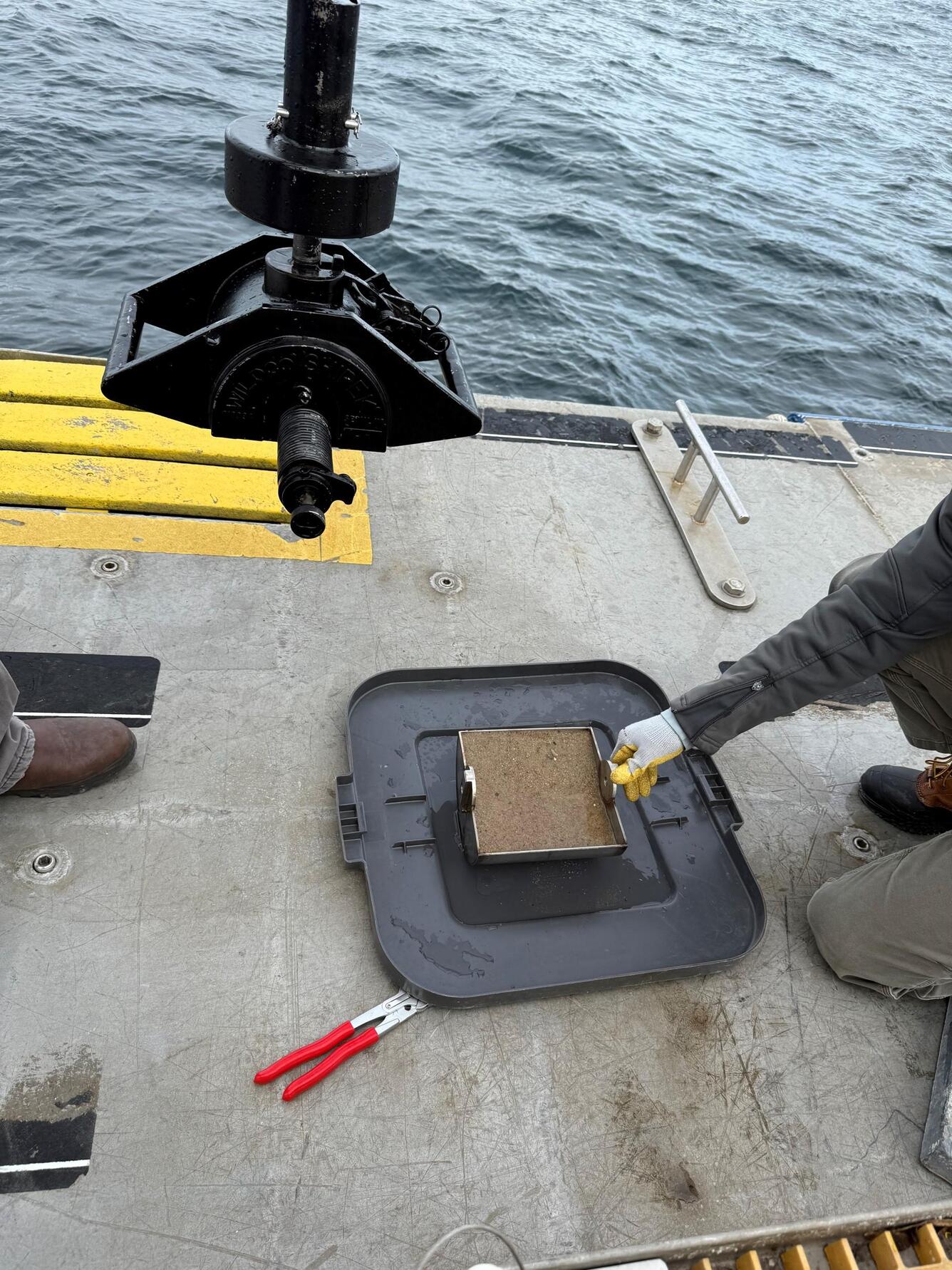 sediment in small equipment next to ocean