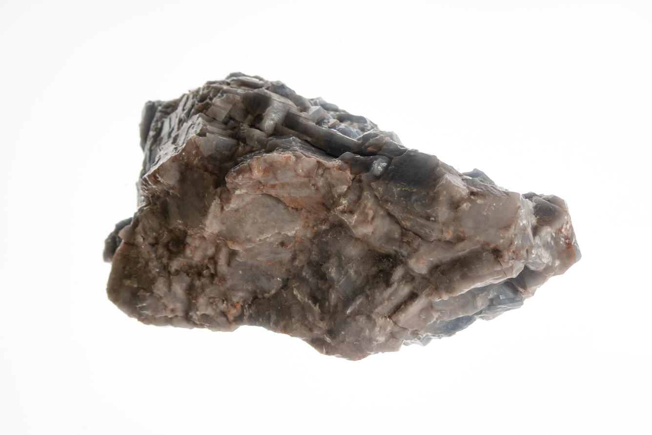 High-definition image of blue calcite specimen with layered crystal structure and pale blue hue.