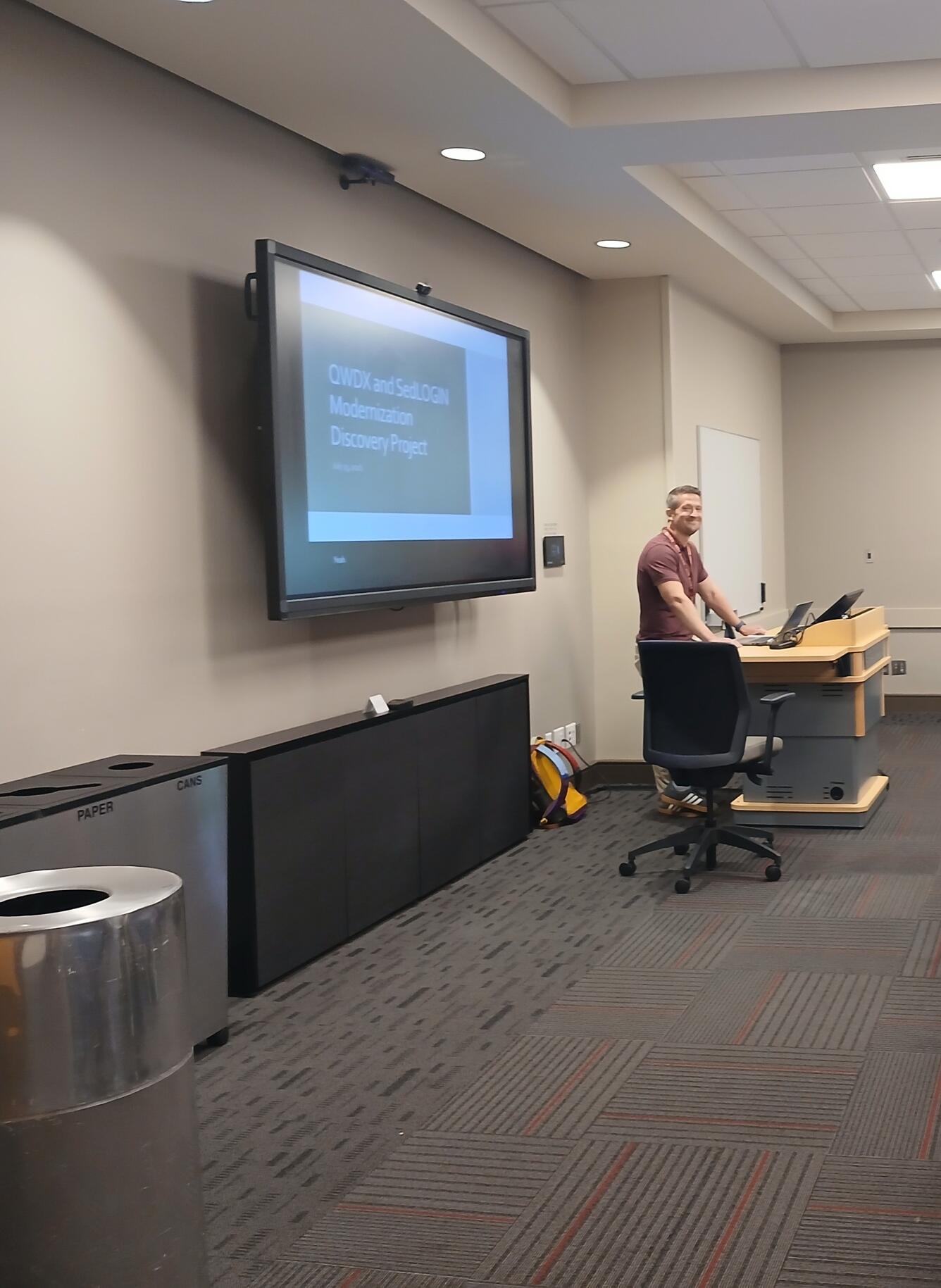 A CPWSC staff member giving a presentation on recent updates to internal data-management systems with the goal of improving efficiency, reliability, and consistency of data produced by USGS.