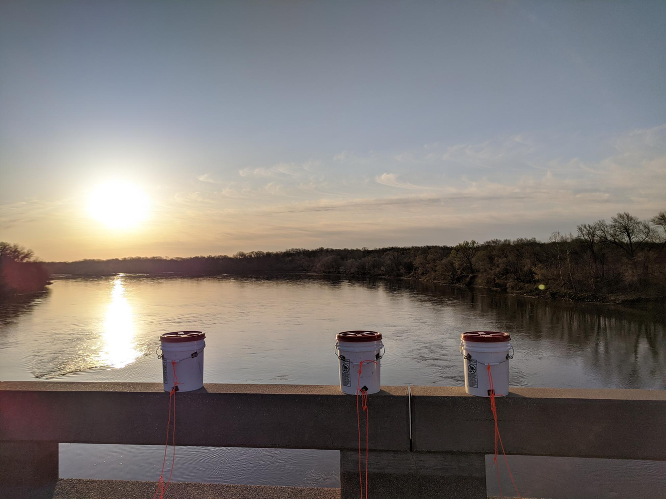 Three dye buckets on the bridge rail