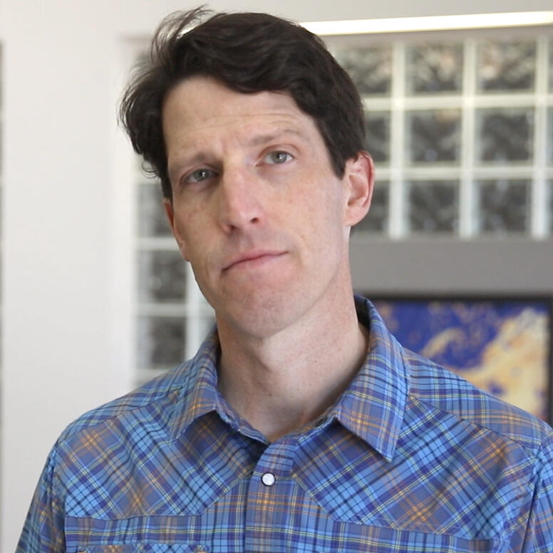 Mugshot of cleanshaven man with dark hair