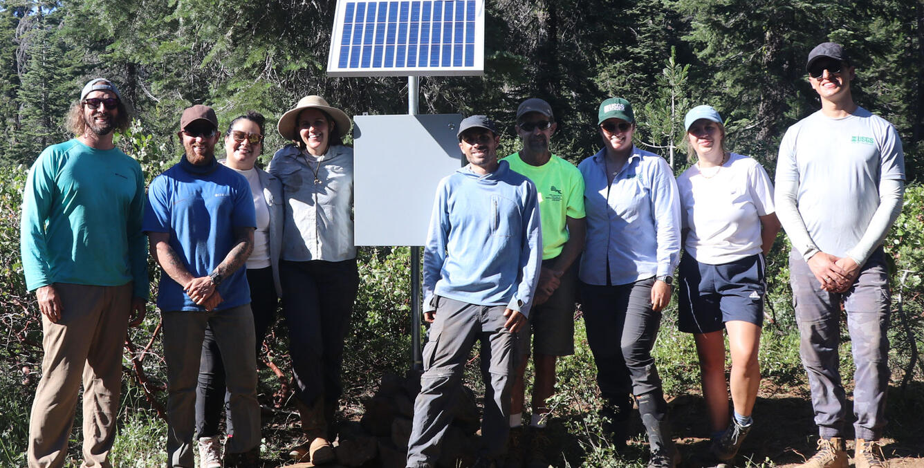 USGS team in front of Squirrel Creek monitoring station