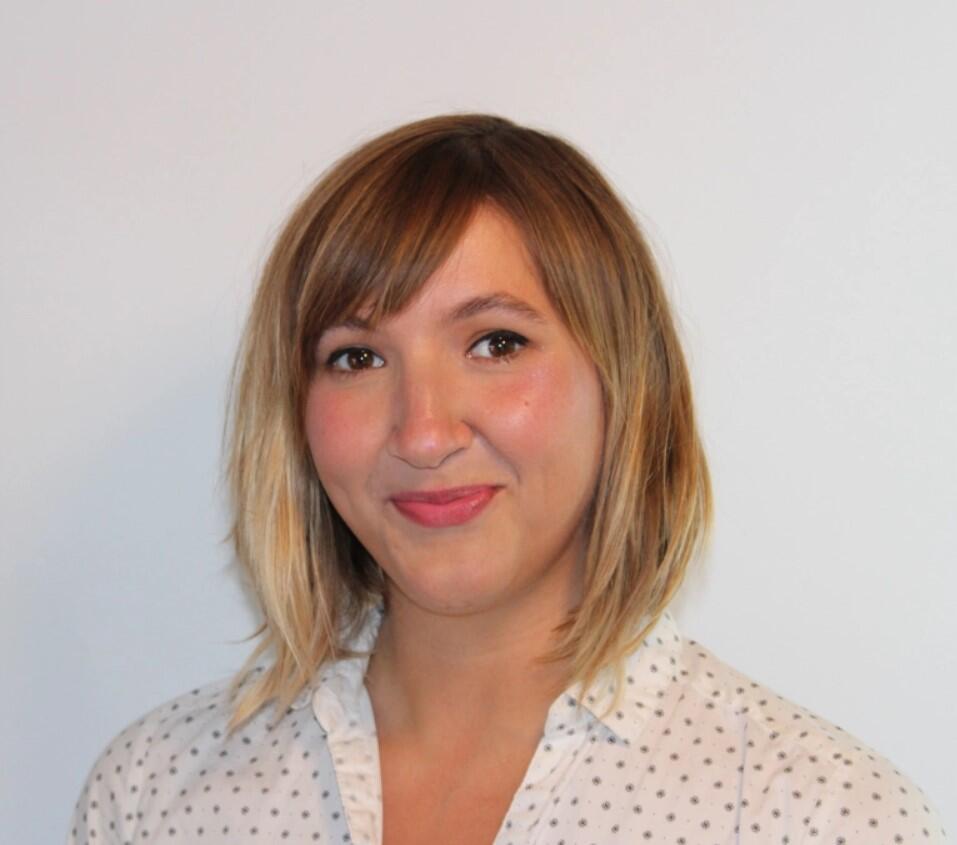 headshot of woman smiling at camera