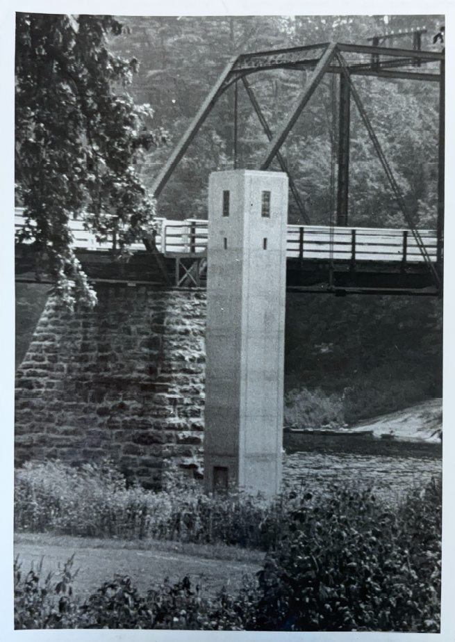 Looking at the gage house next to the bridge