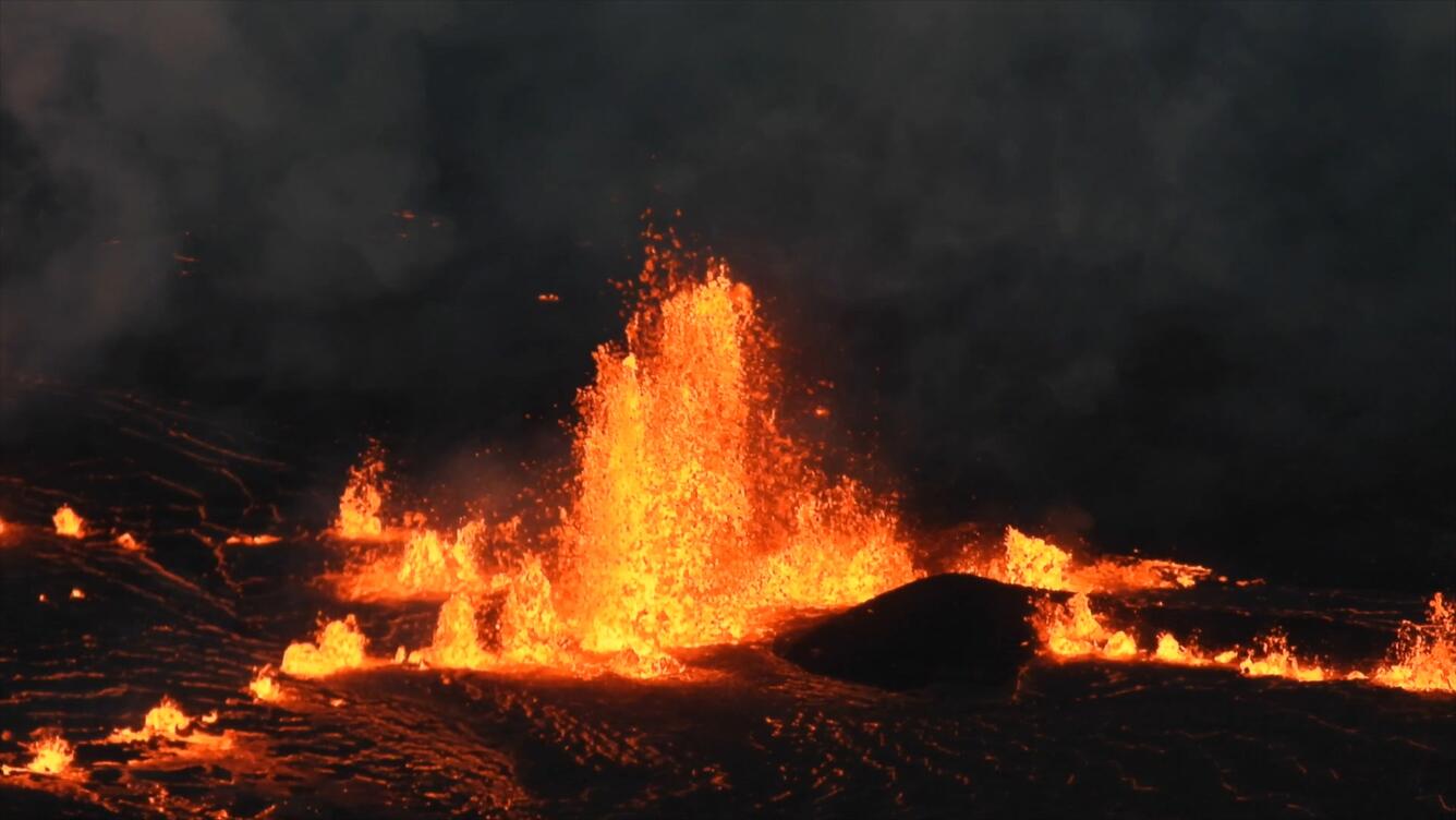 Lava erupting in the dark