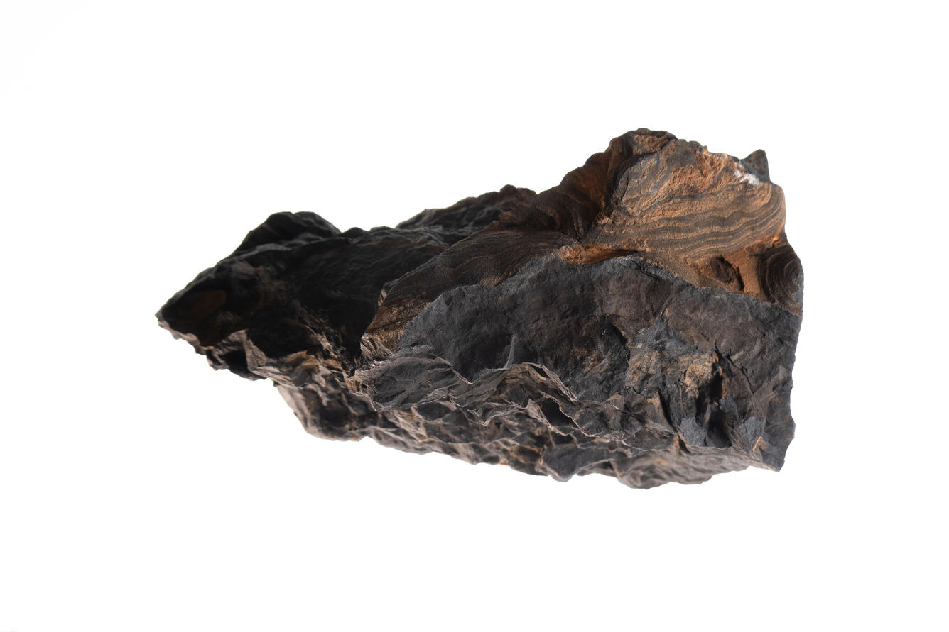 High-definition image of pyrolusite specimen with dark coloration and fibrous structure.