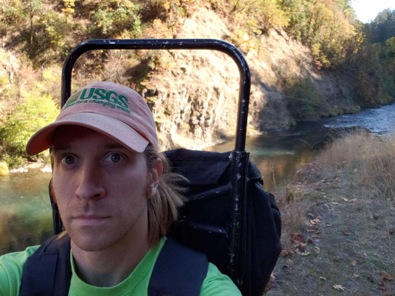 Hydrologist Matthew Yates backpacking in some gear to a field site.