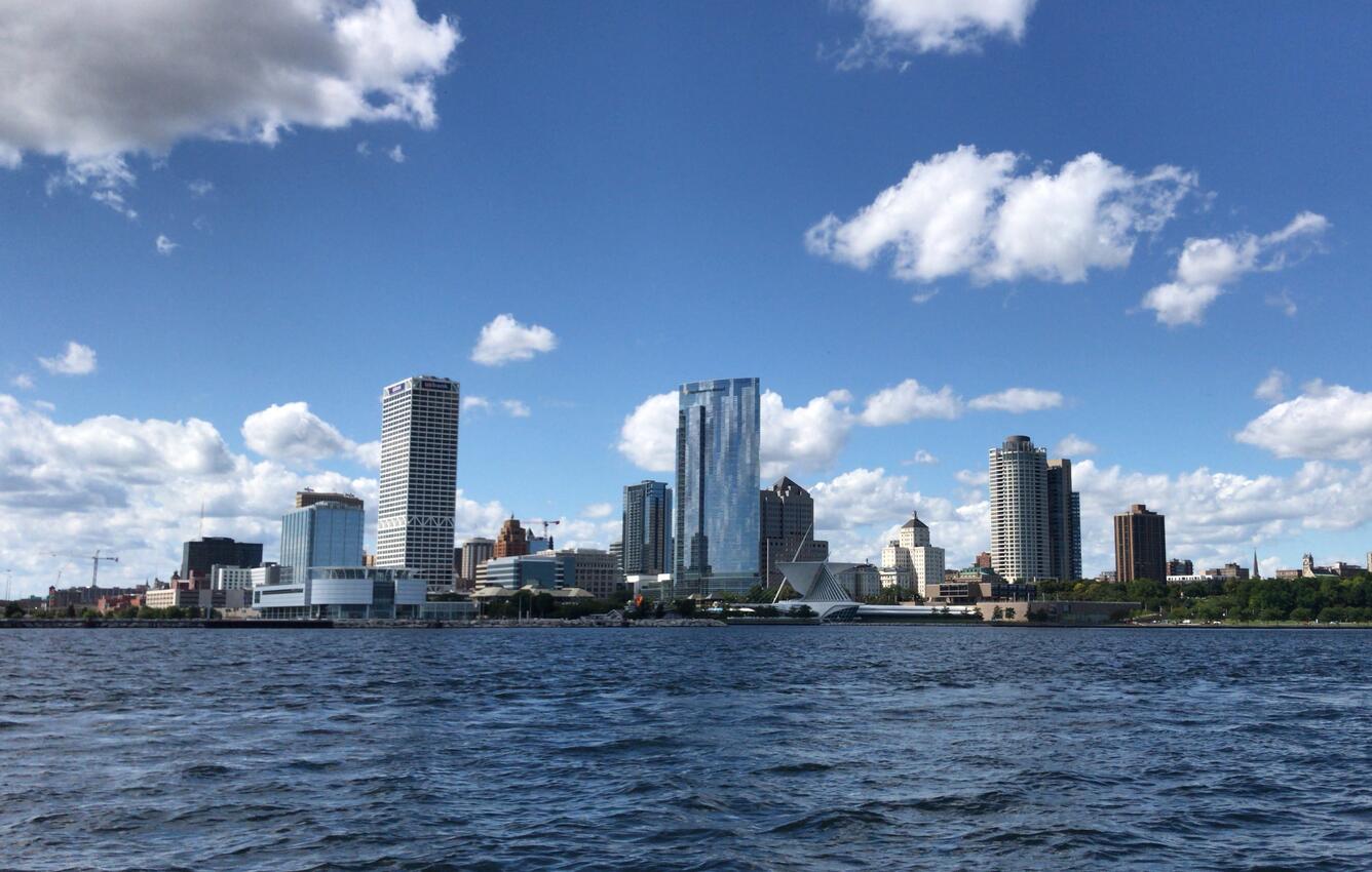 View of Milwaukee, Wisconsin city skyline with water in foreground