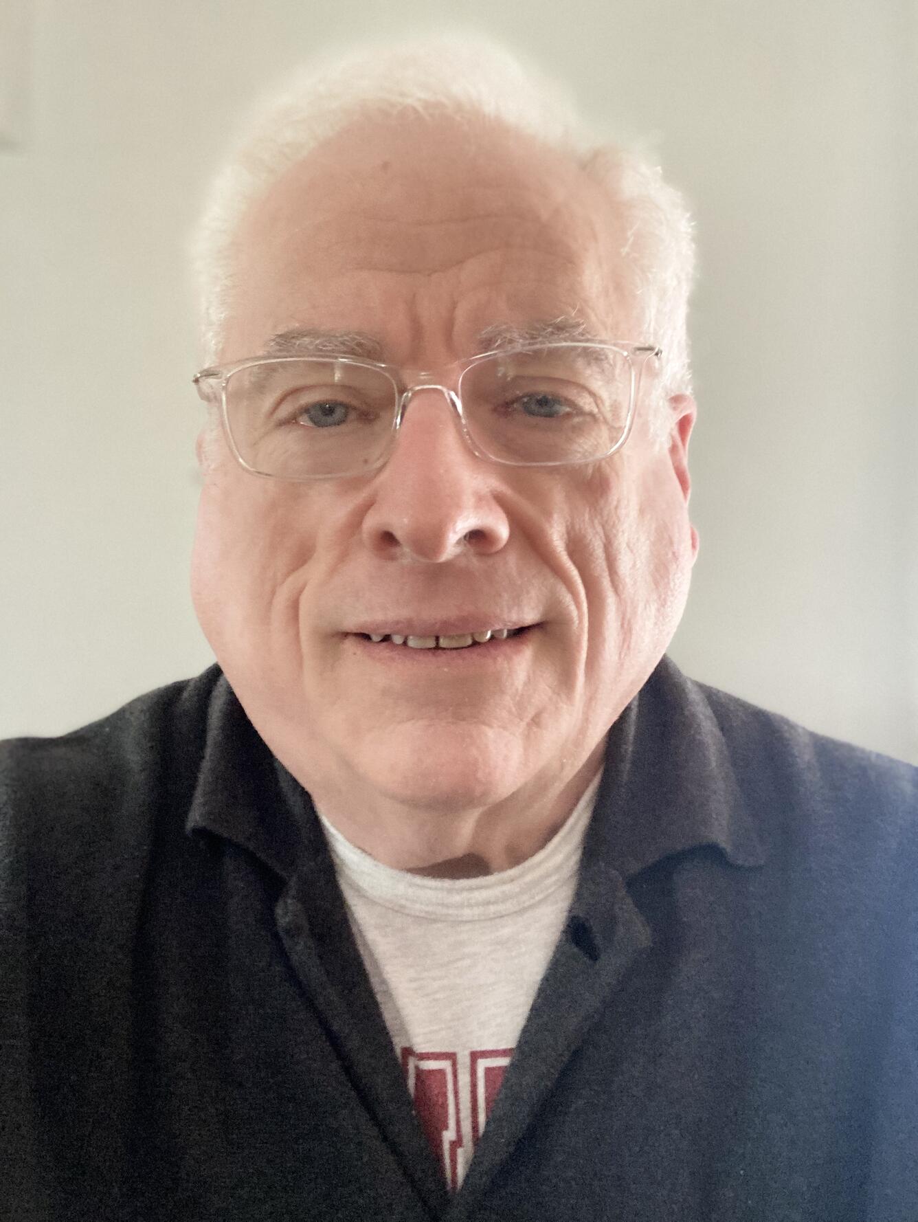 TNMCorps volunteer MRWert513 wearing glasses and a collared shirt. 