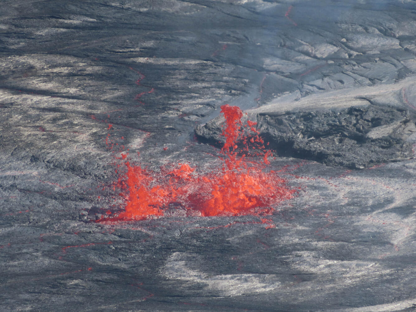 Color photograph of lava erupting