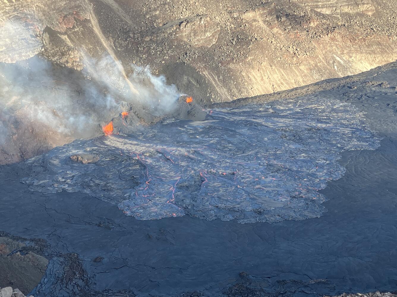 Color photograph of erupting vents and lava flows