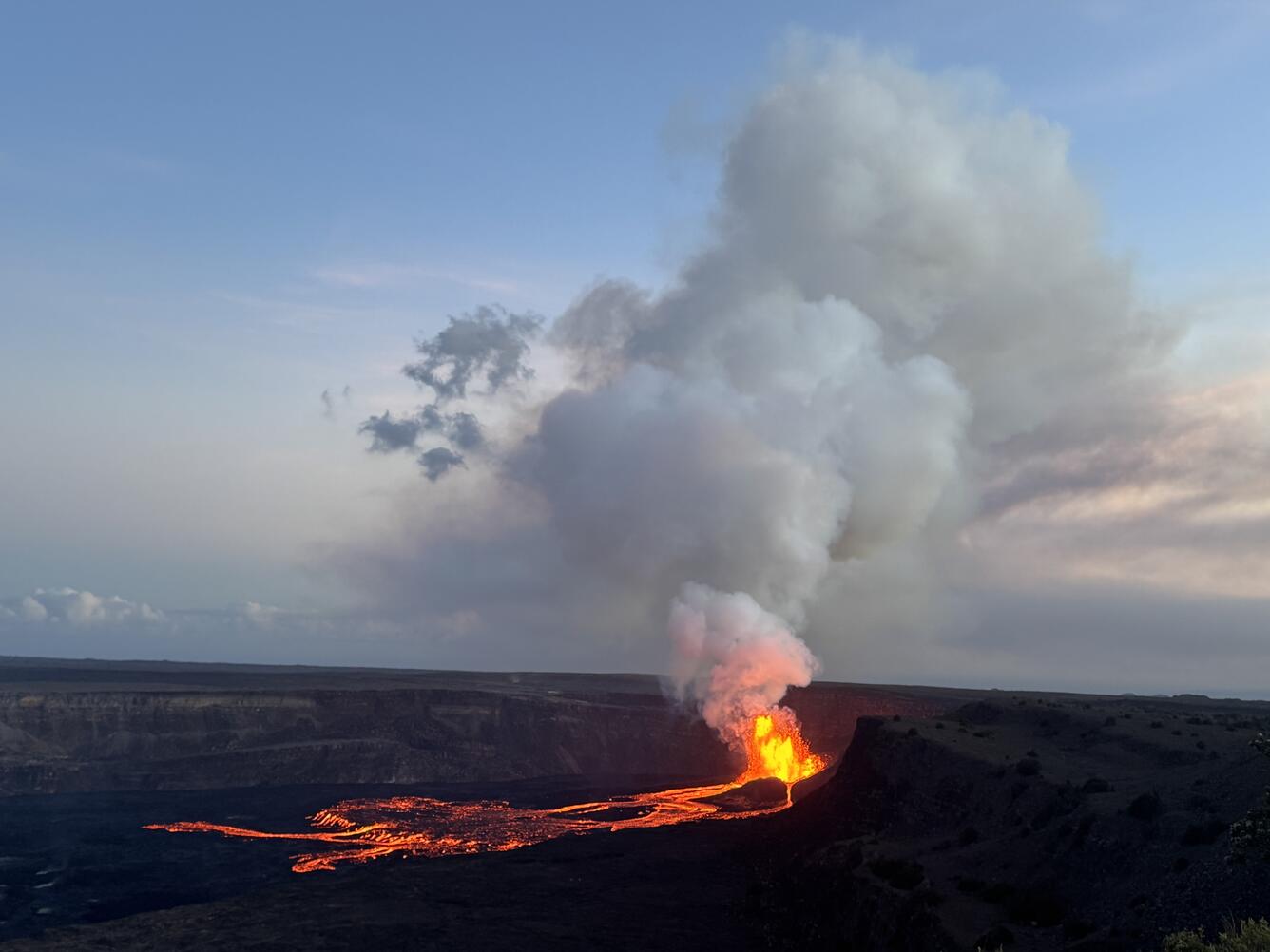 Color photograph of eruption with lava fountains and flows