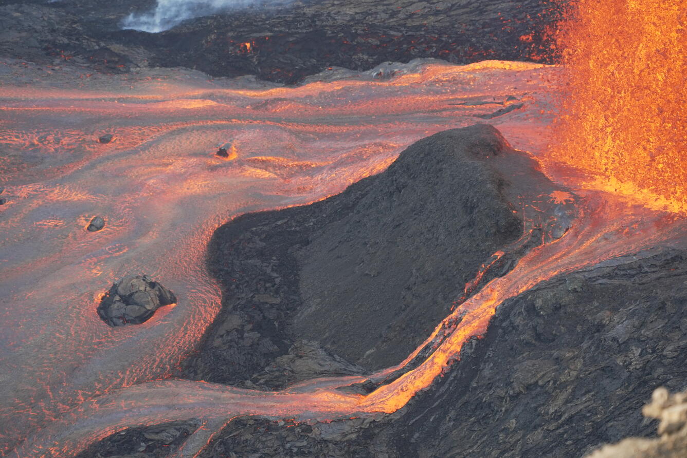 Color photograph of lava flows from volcanic vent