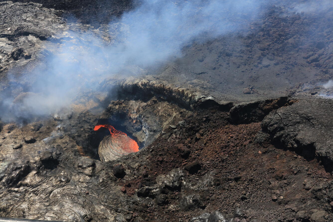 Color photograph of lava pond in volcanic vent