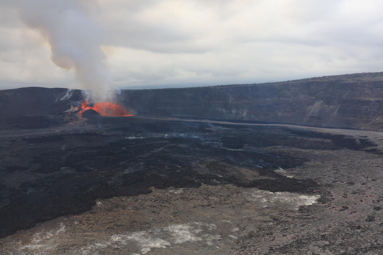 Color photograph of eruption within crater