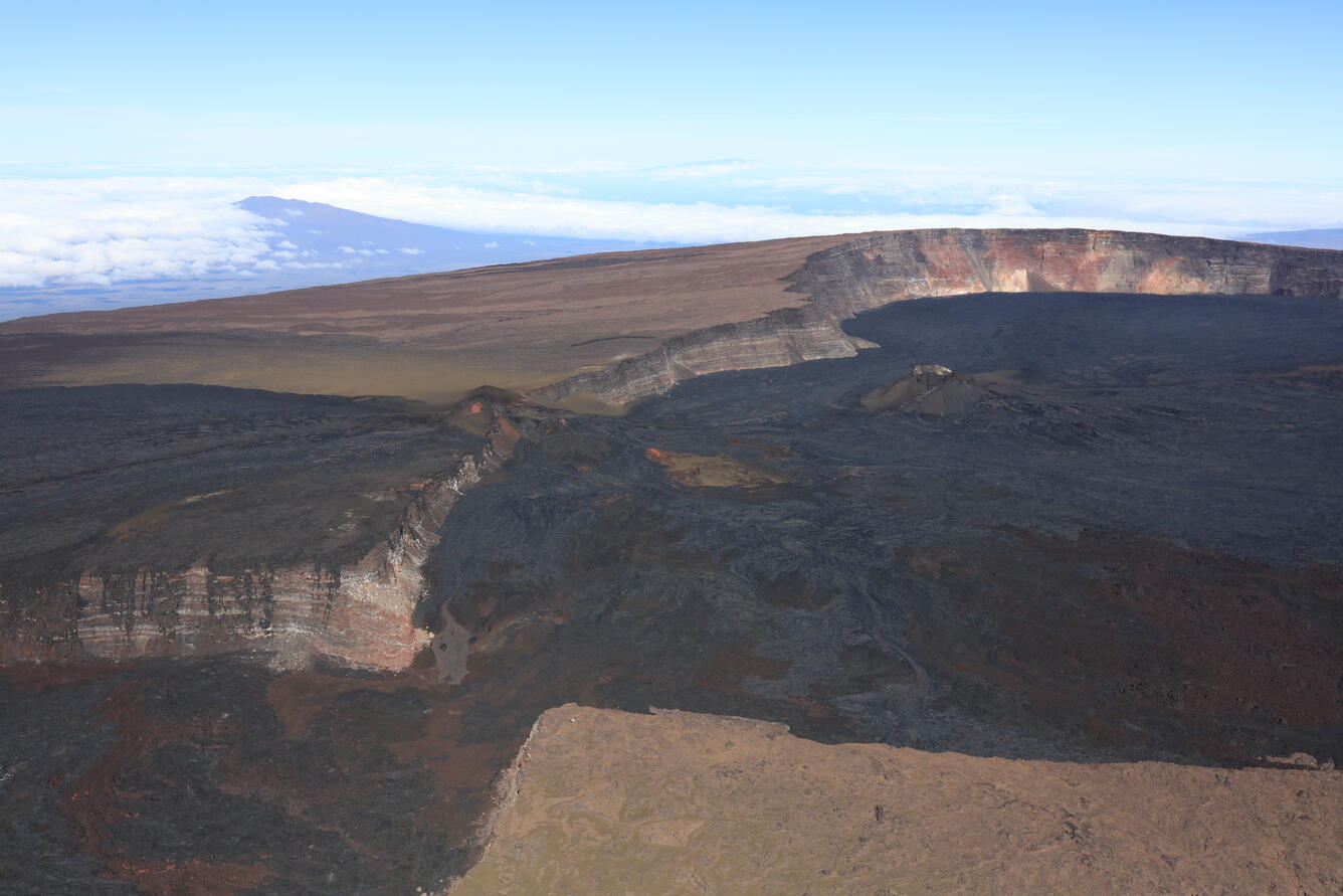 Color photograph of summit caldera at top of volcano
