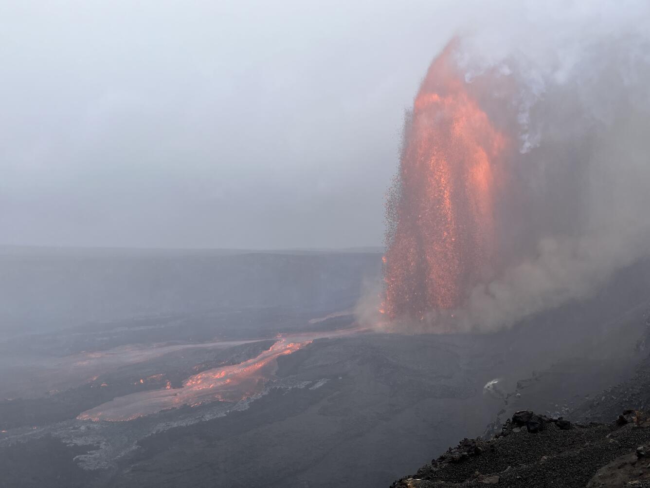 Color photograph of lava fountain in mist