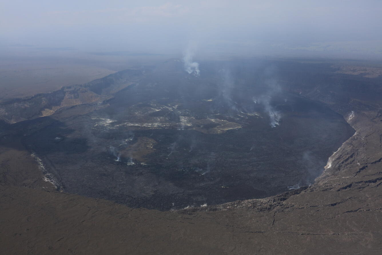 Color photograph of volcanic crater degassing