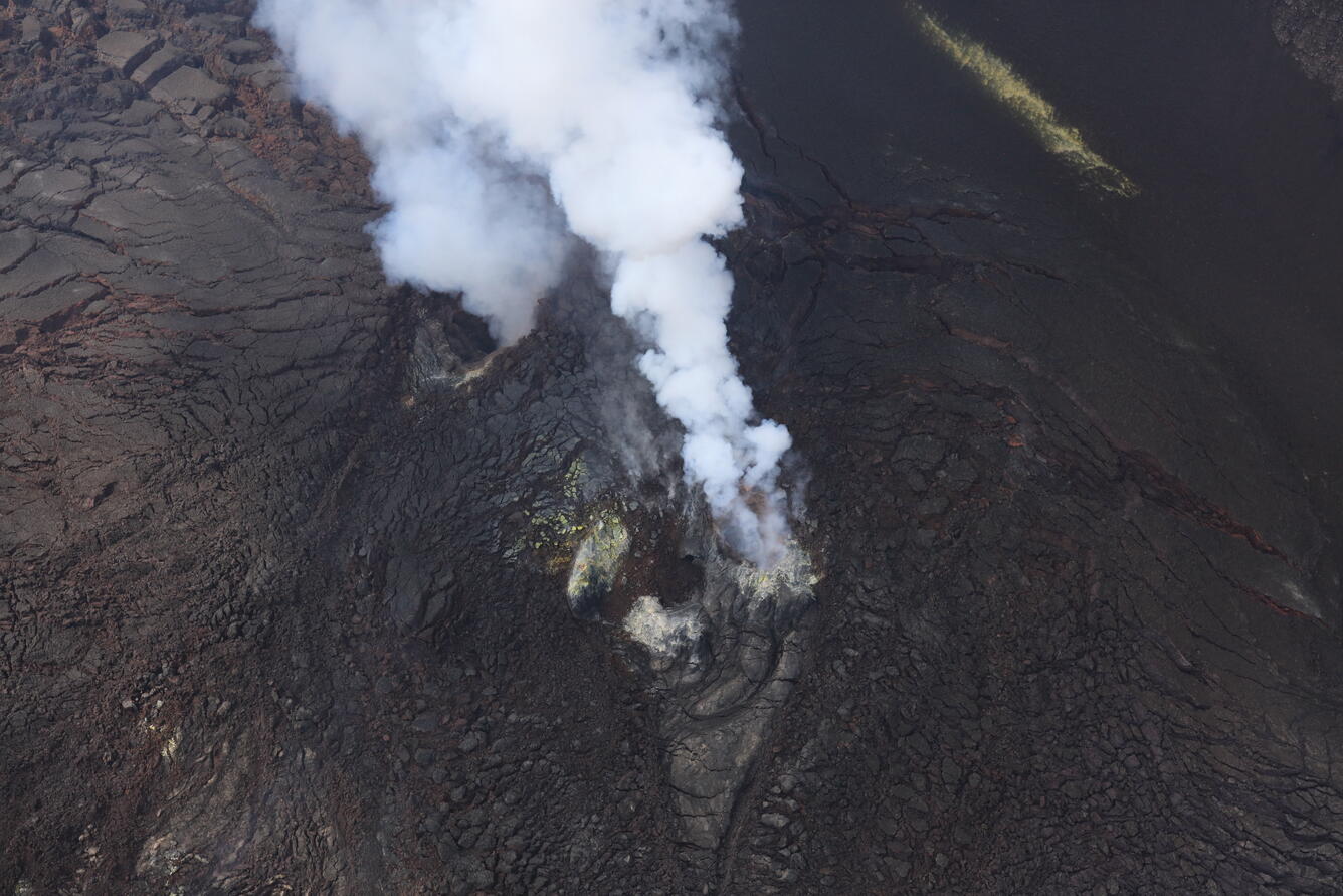 Color photograph of volcanic vents degassing