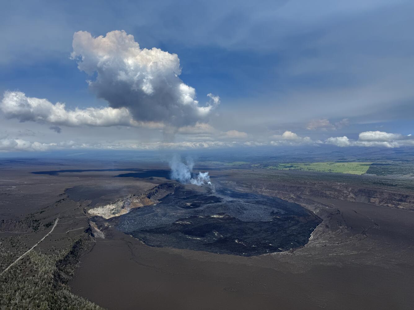 Color photograph of caldera at summit of volcano
