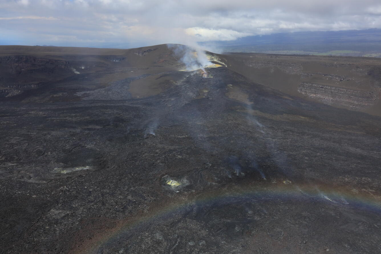 Color photograph of volcanic vents degassing