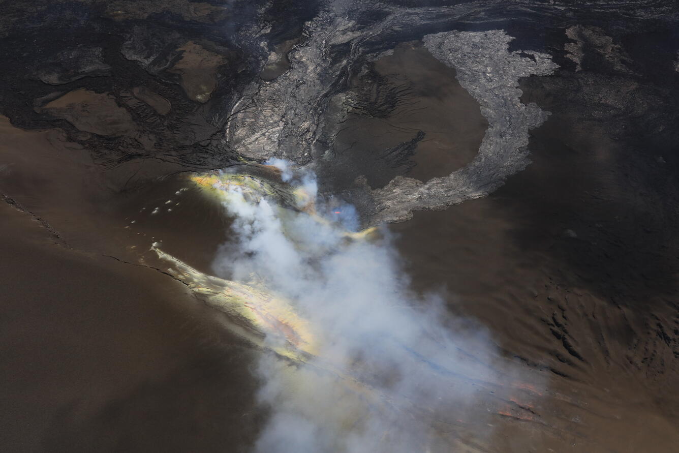 Color photograph of volcanic vents degassing