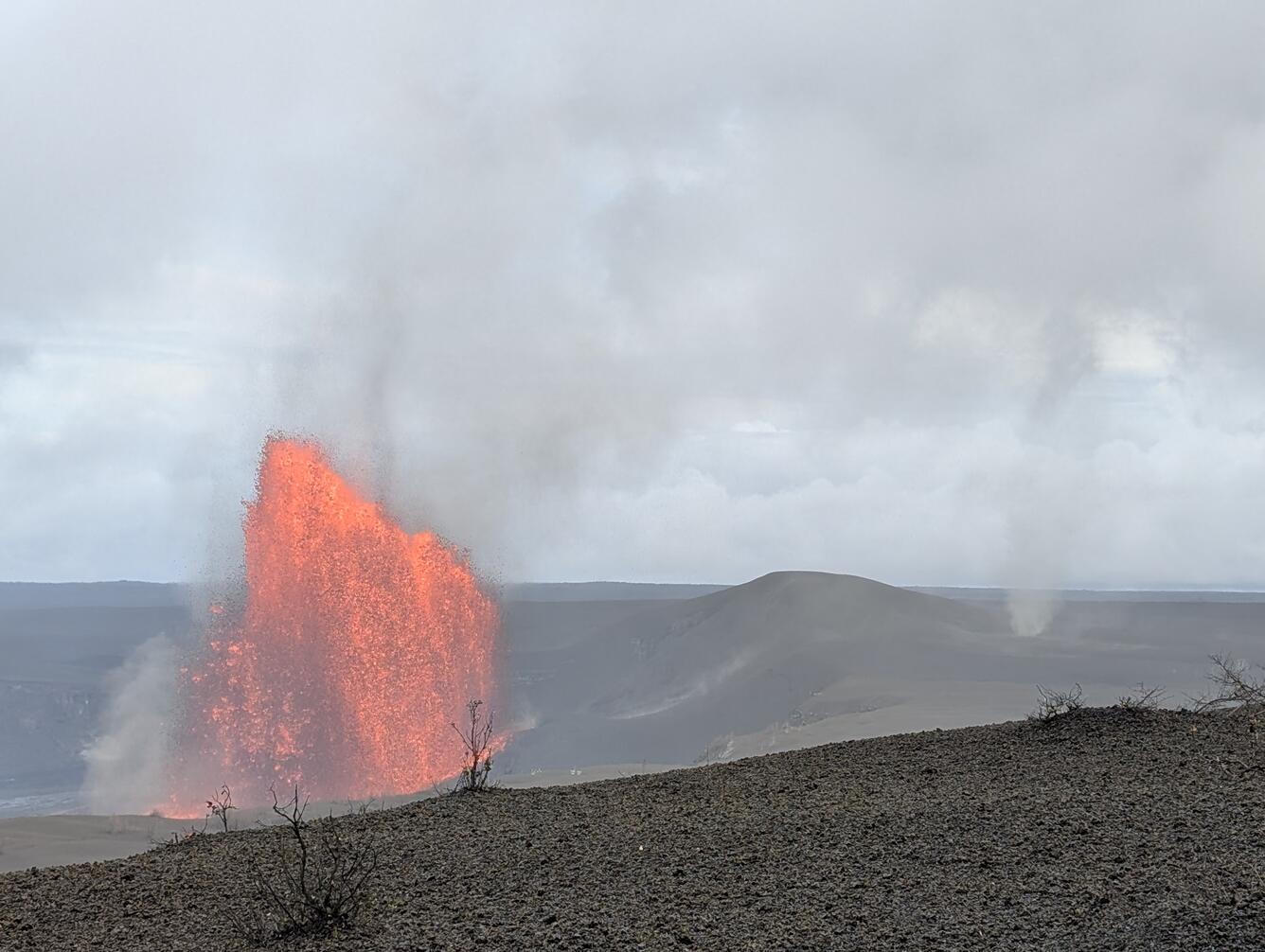 Color photograph of lava fountain and whirlwind